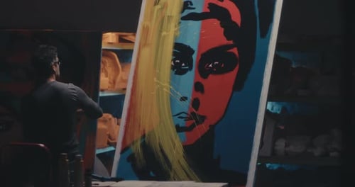 Artist Painting Portrait in Art Studio