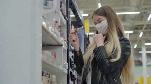 Young Female Buying Cosmetics