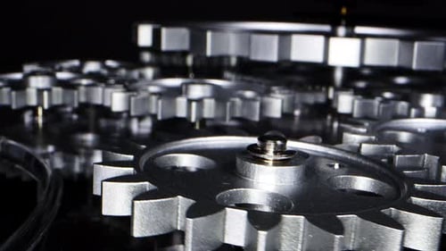 Silver Gears Rotating in Intricate Mechanical System