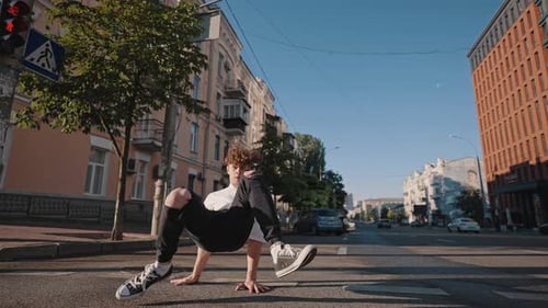 Young Man Performs Hiphop Dance on Empty City Street
