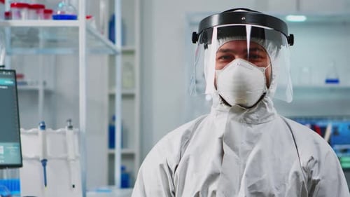 Scientists in Hazmat Suits in a Bright Lab