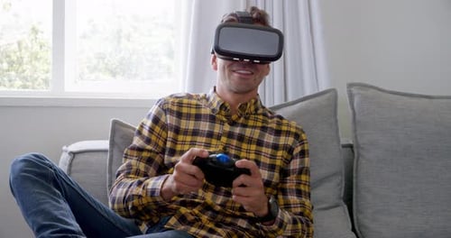 Man Plays Video Games with VR Headset at Home