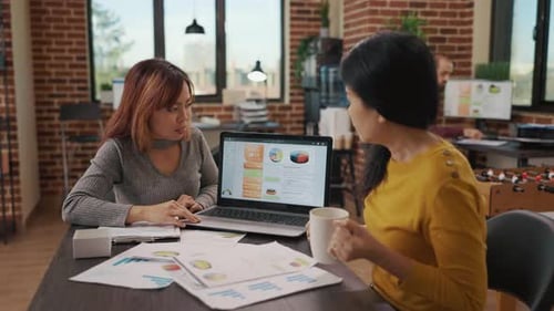 Business Meeting in Modern Office with Data Review