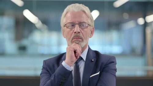 Portrait of Pensive Old Businessman Thinking