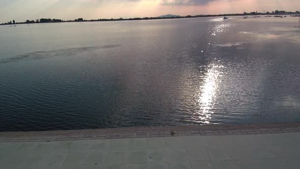 Water pollution with the sun reflection in the grey water., Industrial ...