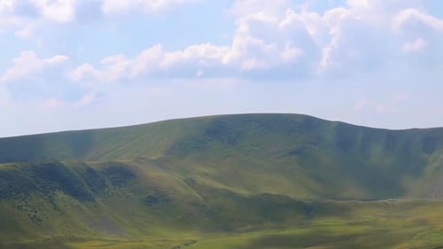 Shadows of the Clouds are Creeping Rapidly Through the Hills and Valley