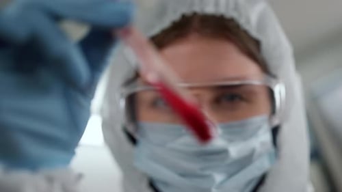Close Up of Medical Researcher Holding Blood Sample