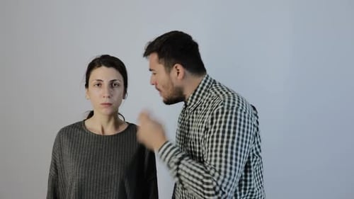 Upset Man Talking to a Distressed Woman
