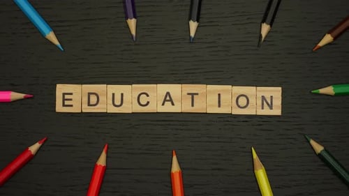 Stop Motion Words FORMATION of Wooden Tiles Colored Pencils Around