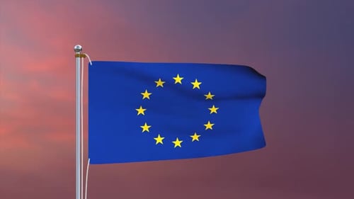 Waving European Union Flag Against a Sunset Sky