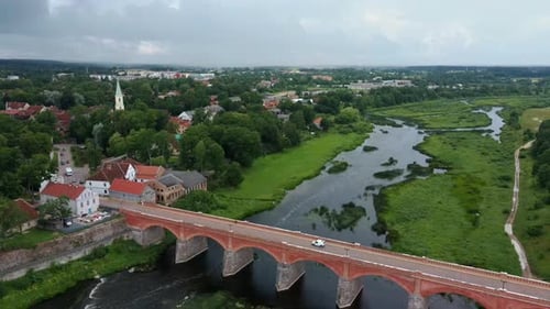 Widest Waterfall in Europe in Latvia Kuldiga and Brick Bridge Across the River Venta