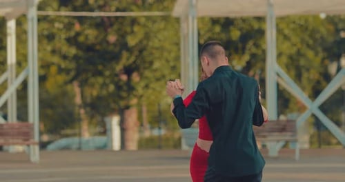 Professional Dancers Dance Tango on the Street in the Summer