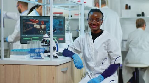 Smiling Scientist at Work in Modern Laboratory