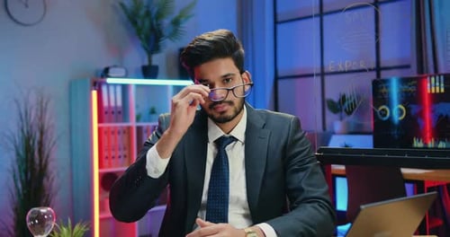 Young Man Smiling in Office Setting
