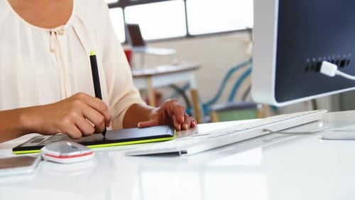 Designer Working at Desk with Tablet and Stylus