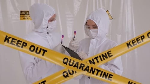 Scientists in Protective Suits Taking Notes in Quarantine