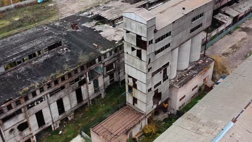 Ruined factory with damaged roof.