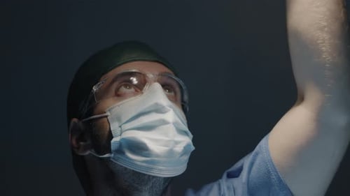 Doctor adjusts the operating light