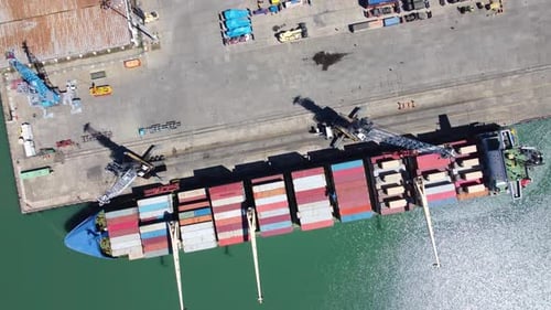 Unloading Cargo Ship At Port
