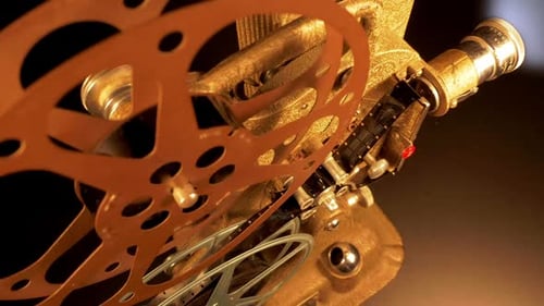 Vintage Film Projector with Reels in Motion