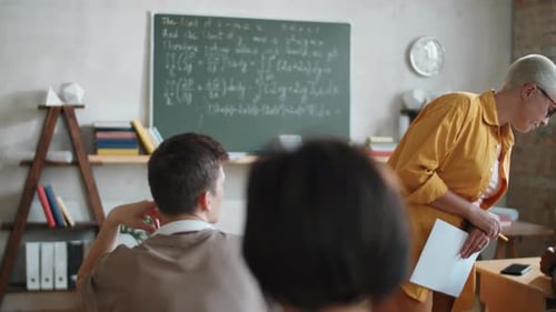 Teacher Leading Math Class in School Classroom