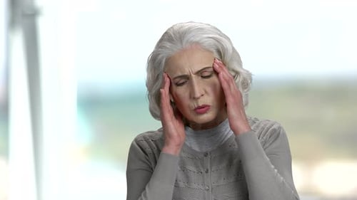 Senior Woman Experiencing a Headache
