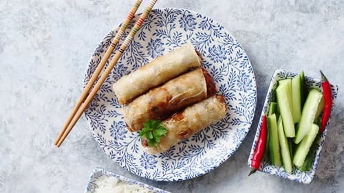 Orginal Asian Deep Fried Spring Rolls Placed on Beautiful Oriental Style Plate