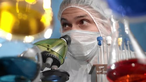 Scientist Works With Microscope in the Lab