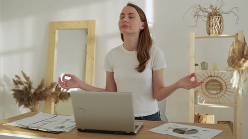Woman Doing Yoga at Her Desk