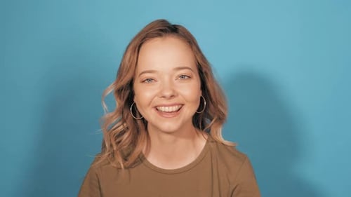 Young beautiful smiling woman girl posing in studio