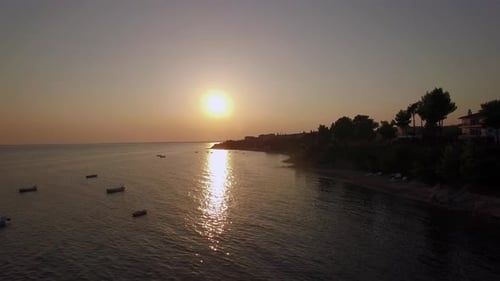 Aerial Scene of Shore and Sea with Boats at Sunset, Greece