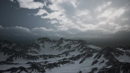 Aerial View Flying Over Vast Snowy Mountain Peaks