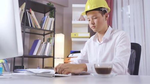 The worker works at a desk.