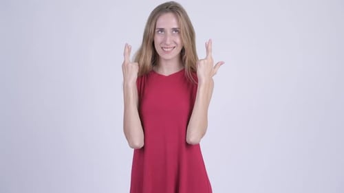 Woman Crossing Fingers in Hope for Success