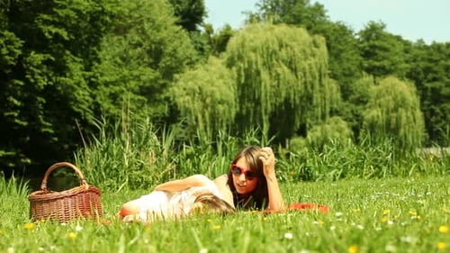 Little Daughter Kissing Her Mother On The Meadow
