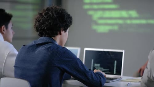 Student Typing Codes At Programming Class