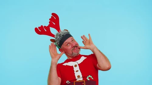 Man in Christmas Tshirt Listening Music Via Earphones Dancing Disco Fooling Around Having Fun