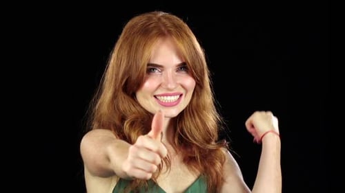 Woman Smiles and Gives Two Thumbs Up