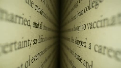 Close Up Zoom Along Open Book Pages