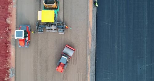 Aerial View of Road Construction with Heavy Machinery