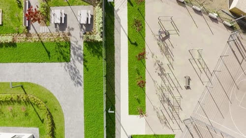 Top view of sports field near residential building