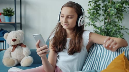 Girl Listening to Music on Headphones