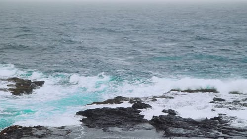 Video Footage of the Ocean Waves Washing Up on a Black Volcanic Rocks on Cabo Verde