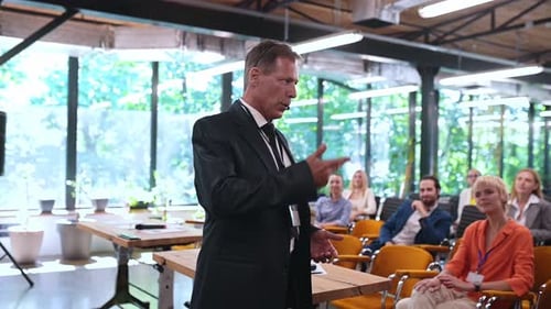 Speaker Addressing Audience at Corporate Conference