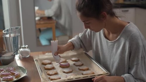 Mixed-race Girl Decorating Handmade Bakery Products
