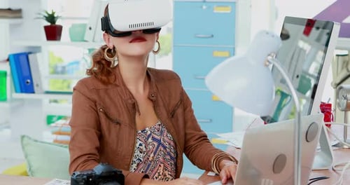 Woman Uses Virtual Reality Headset at Modern Desk