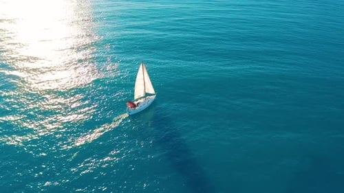 Aerial View. Yacht Sailing on Opened Sea. Sailing Boat. Yacht From Above. Yachting at Windy Day. The