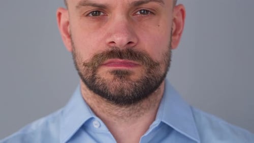 Adult Putting On Surgical Face Mask Close Up