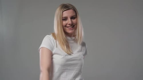 Young Woman Gives Two Thumbs Up