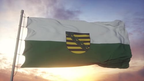 Flag of Saxony Waving in Golden Sunset Sky